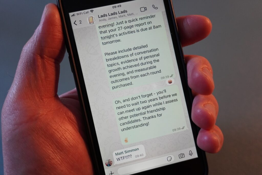 A phone held in a hand showing a preview of a WhatsApp chat. That's mentioned in the article.